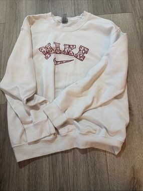 Nike White Crewneck Sweatshirt with Maroon Leopard Logo